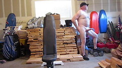 Naked and hard in the open garage. Thumb