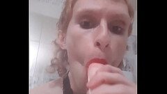 Femboy twink loves giving a sloppy blowjob to a big dildo Thumb