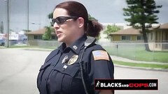 Curvy blonde MILF officer is sitting on a black criminal&#039_s big cock in public. Thumb