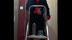 crossdressing bisexual sissy loves the taste of his own piss as he stands on a ladder pissing in a b Thumb